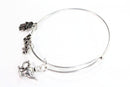 Silver Tone Charm Bangle with Hamsa Hand, Hope, and Genie Lamp Charms